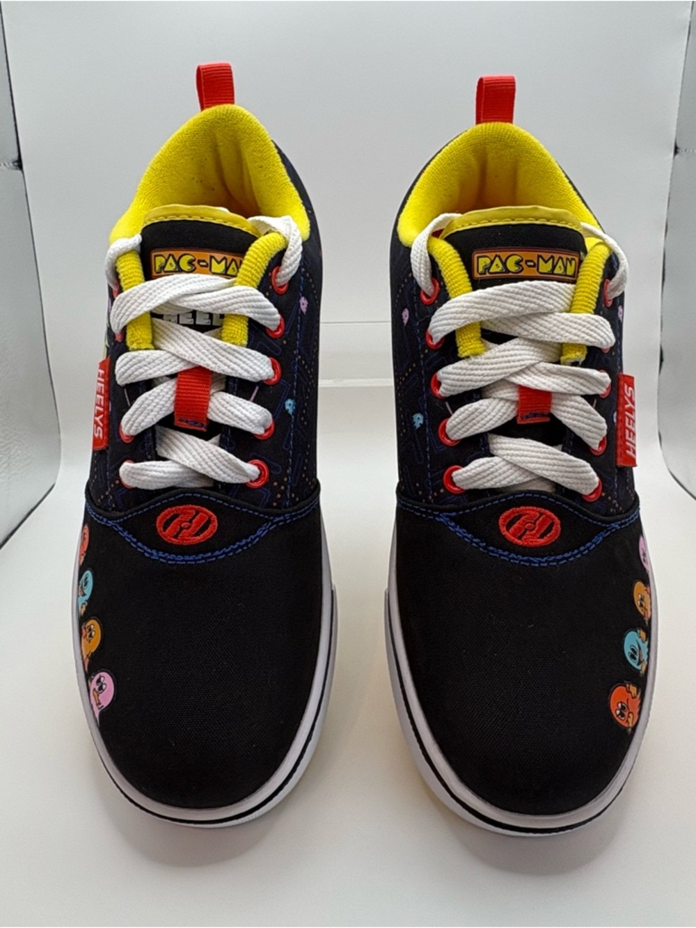 PAC Man Heelys
Kids Black Lace-Up Sneakers with Yellow Lining